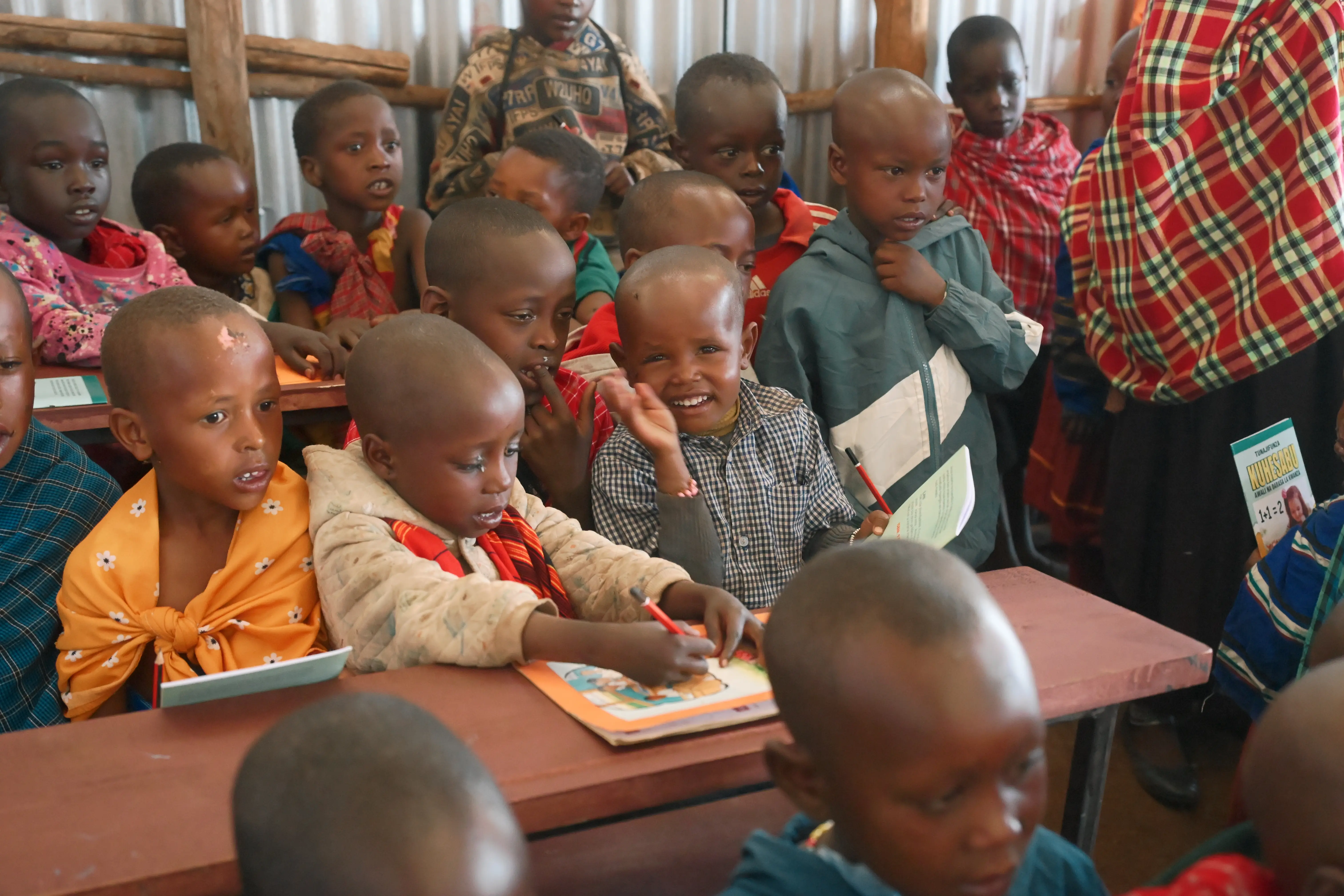 The children were laughing happily at their new tables and chairs.