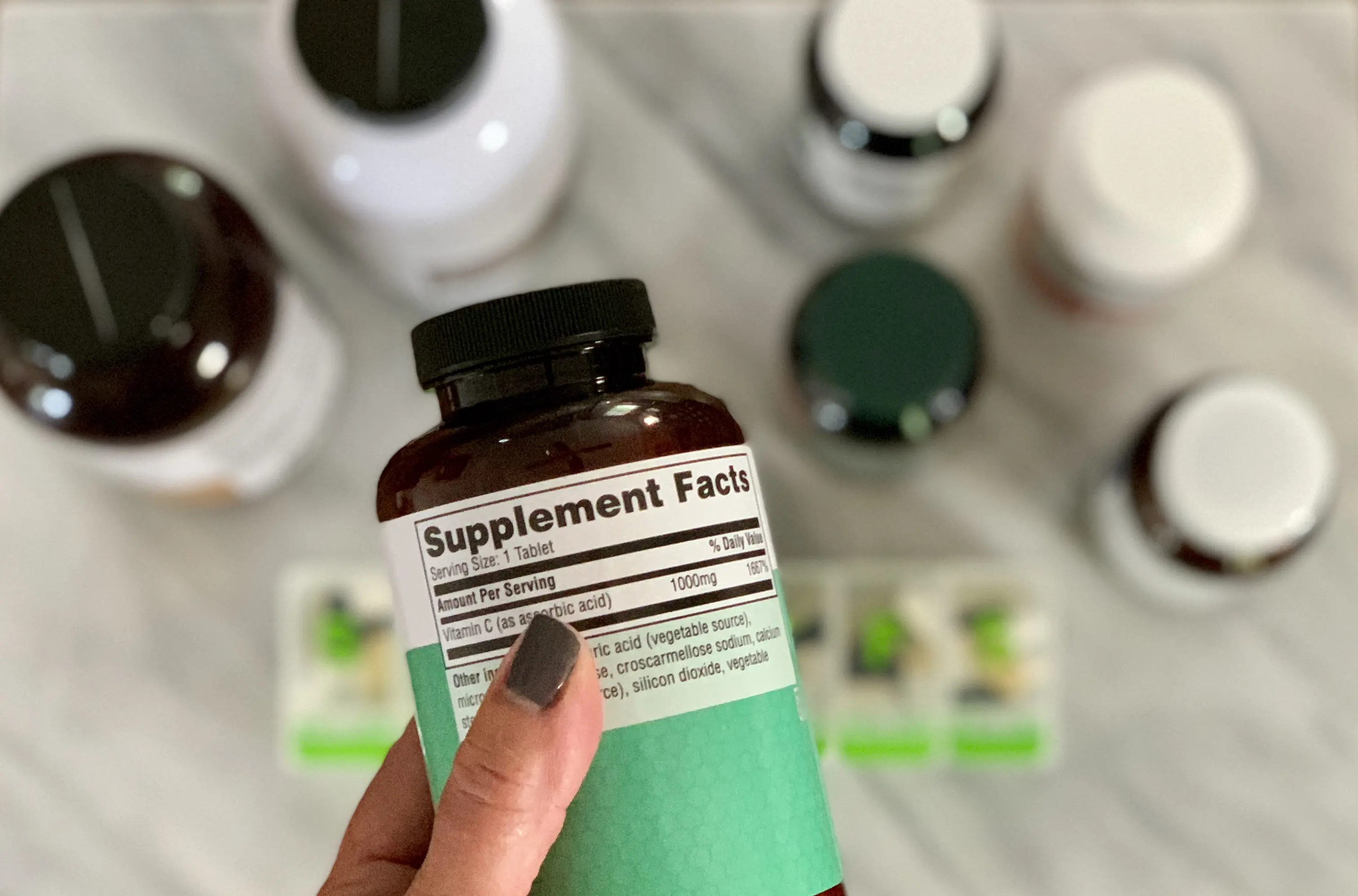 Woman Reading Supplement Label Showing FDA Daily Values for Women